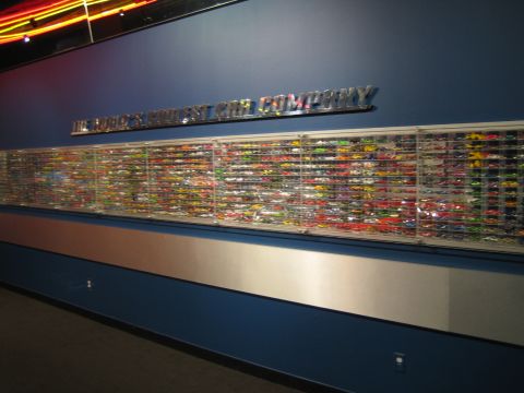 1968 Ford Mustang - A large collection of model cars is displayed on a wall at the Petersen Automotive Museum.