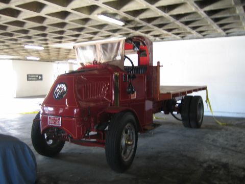 1968 Ford Mustang - This antique truck has a unique design with a rounded front and a flatbed for cargo.