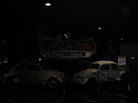 1968 Ford Mustang - Two Volkswagen Beetles, one decorated as Herbie, are displayed at the 'Cars of the Stars' exhibit.
