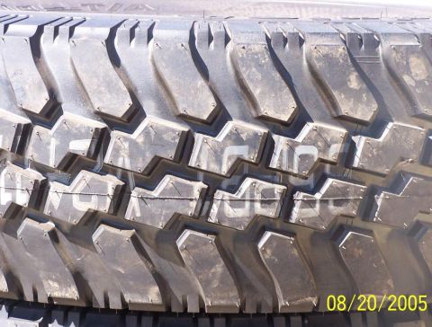 1990 Ford Bronco - close-up of a chunky mud-terrain tire tread block pattern, dated August 20, 2005.