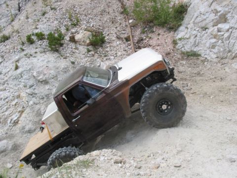 1981 Ford Bronco - This modified vehicle navigates a steep, rocky terrain.