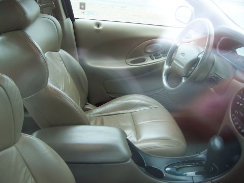 1996 Mercury Sable - Interior view of a 1996 Mercury Sable, highlighting the tan leather seats and dashboard controls.