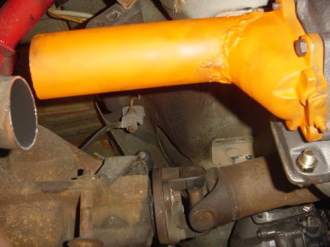 1995 Ford Mustang - Underside view of a vehicle's drivetrain components, including the driveshaft and differential.