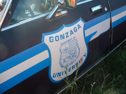 1999 Ford Crown Victoria - Close-up of a police car door the Gonzaga University Security emblem, indicating its former service.