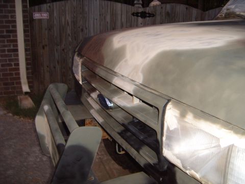 1988 Ford Bronco - The front end of a vehicle, likely a truck or SUV, is shown with its grille and hood prepped for paint. The registry claims it is a 1988 Fo…