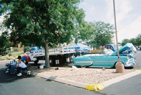 1972 Ford Ranchero - Classic cars and a truck are on display at an outdoor event.