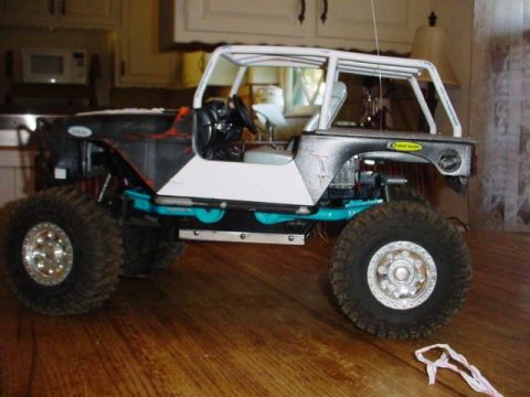 1988 Ford Bronco - This RC crawler has a custom body and suspension, resembling a modified off-road vehicle.