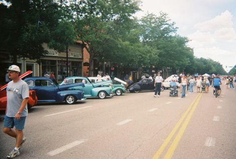 1972 Ford Ranchero - Several classic cars are displayed with their hoods open at an outdoor car show event.