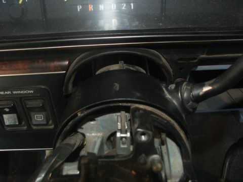 1989 Ford Bronco - The dashboard and steering column interior of a vehicle are visible, with the gear selector showing 'PRND21'.