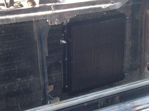 1982 Ford Bronco - Close-up of an aftermarket oil cooler installed in front of a radiator.