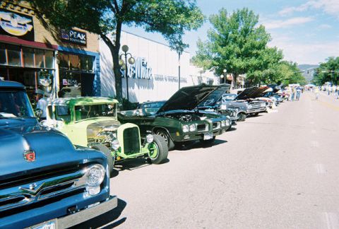 1972 Ford Ranchero - A lineup of vintage vehicles on display at an outdoor car show.