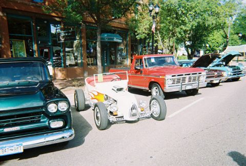 1972 Ford Ranchero - Cars lined up at a show, a vintage GMC, a custom hot rod, and a red Ford pickup truck.