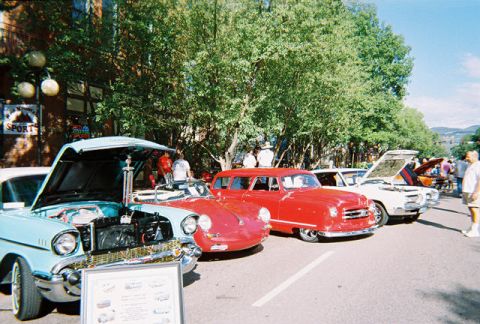1972 Ford Ranchero - A row of classic cars are displayed at an outdoor event, with a 1957 Chevrolet Bel Air in the foreground.