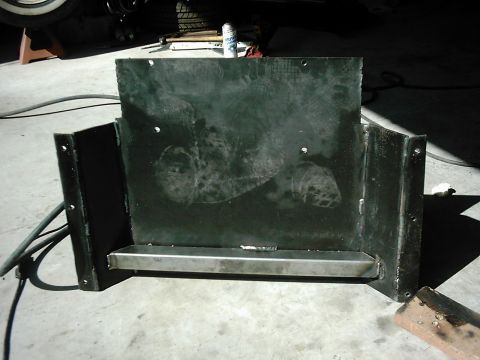 1978 Ford Bronco - A black metal transfer skid plate is shown, with a silver bar welded across its lower section.
