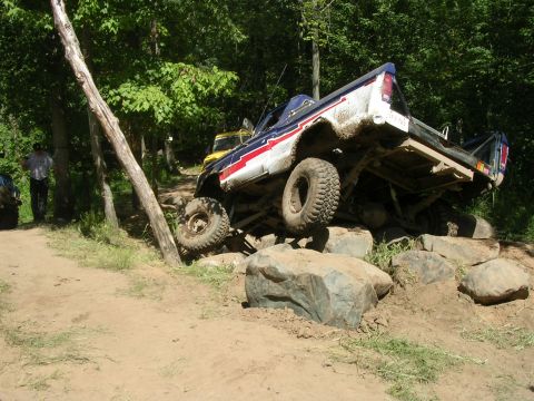 1977 Ford F-150 - This 1977 Ford F-150 is navigating a difficult rocky obstacle on an off-road course.