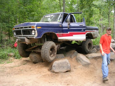 1977 Ford F-150 - This lifted 1977 Ford F-150 navigates a challenging off-road course with one wheel in the air.