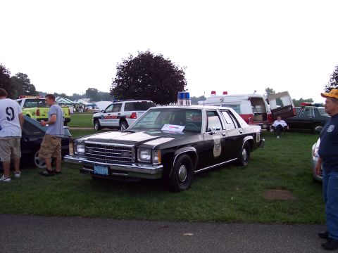 2001 Ford Crown Victoria - This police car appears to be from the early 1980s, not a 2001 model, with its distinct body style and grille.