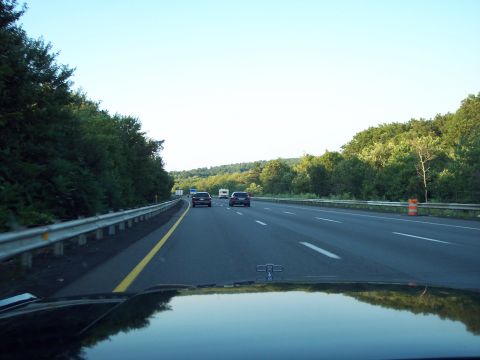 2001 Ford Crown Victoria - Driving on a highway with trees and other vehicles visible under a clear sky.