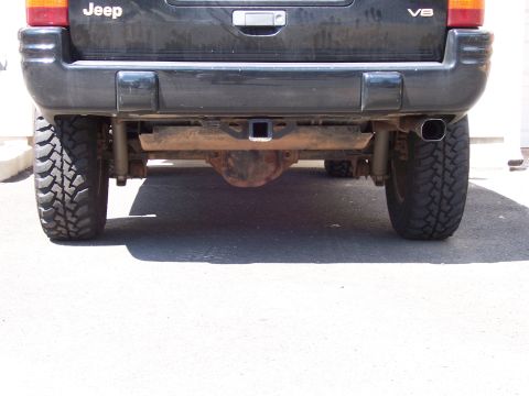 1996 Jeep Grand Cherokee - Rear view of a 1996 Jeep Grand Cherokee, equipped with a V8 engine and trailer hitch.