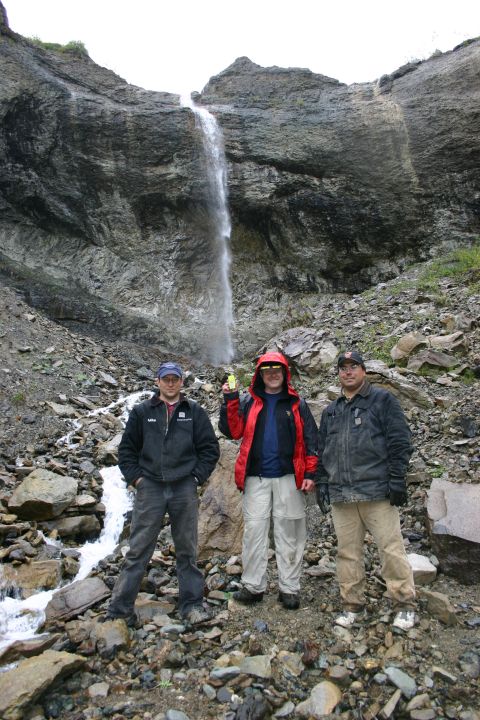 2003 Jeep TJ - A group of men pose for a photo in front of a scenic waterfall.