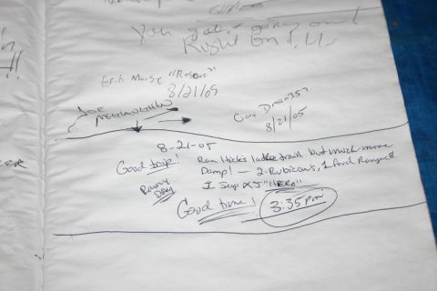 2003 Jeep TJ - Handwritten notes on white fabric detail a trip with names, dates, and mentions of vehicles.