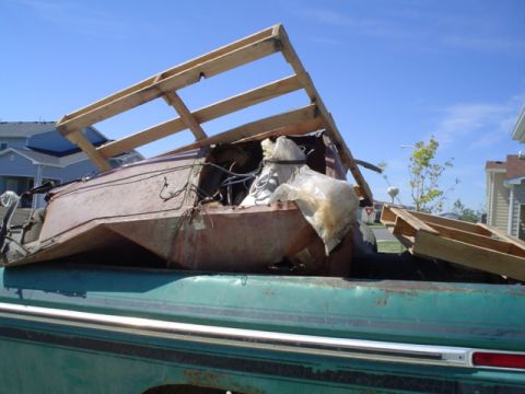 1981 Ford Bronco - Old refrigerator, about 20 metal fence posts, and a huge aluminum cattle feeder that had been burned and broken into like 4 peices