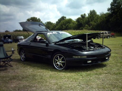 Black 1995 Ford Probe with hood and trunk open