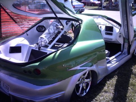 1995 Ford Probe - This heavily modified vehicle features custom paint, doors, and interior modifications.
