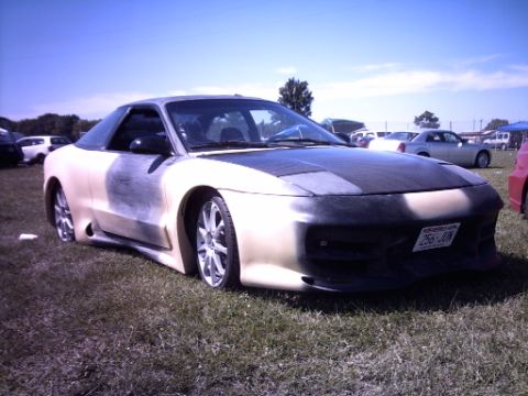 1995 Ford Probe - Customized 1995 Ford Probe shown at an outdoor car event.
