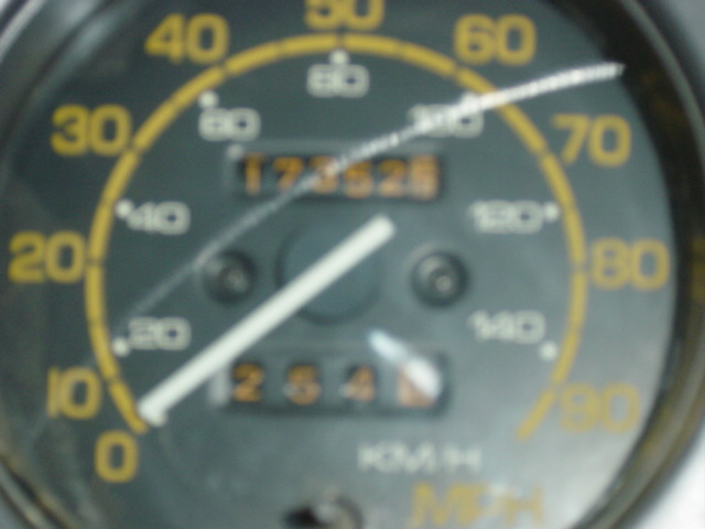 Close-up of a car's speedometer showing 173526 miles and 254 miles on the trip odometer
