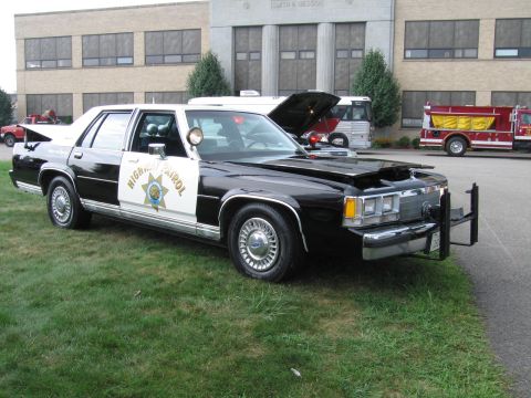 1991 Ford Crown Victoria - This 1991 Ford Crown Victoria police car is on display with other vehicles.