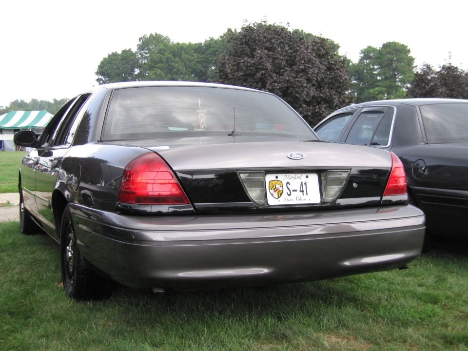 Rear view of gray Ford Crown Victoria sedan with Maryland S-41 license plate