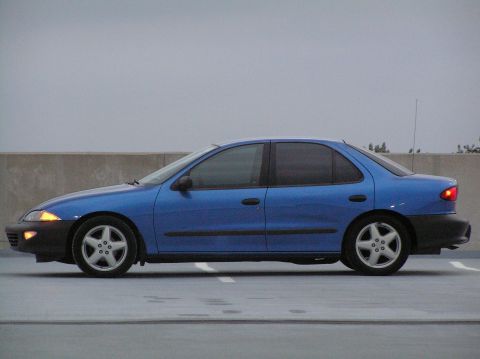 1996 Chevrolet Cavalier - Side profile of a blue 1996 Chevrolet Cavalier sedan parked outdoors.