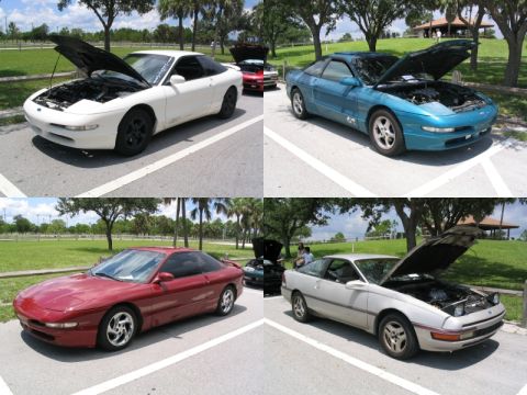 1997 Ford Probe - Four 1997 Ford Probes are parked in a lot with their hoods open.