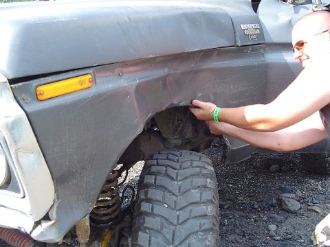 1979 Ford Bronco - Repairing damage to the fender of a 1979 Ford Bronco, focusing on the wheel well area.