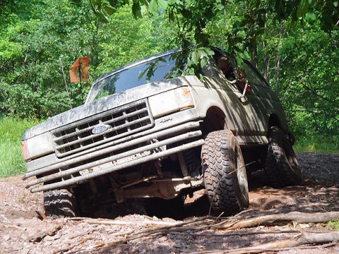 1979 Ford Bronco - Ford Bronco stuck in mud on an off-road trail.