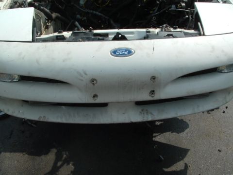 1996 Ford Probe - Front view of a 1996 Ford Probe with the hood open, revealing the engine compartment.