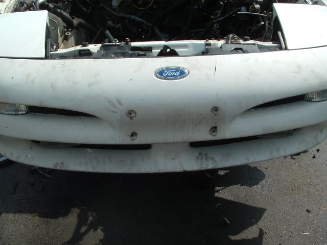 1996 Ford Probe front end, hood open showing engine bay. Ford logo on grille