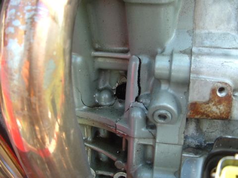 1996 Ford Probe - Close-up of a cracked engine block, indicating significant damage to the component.