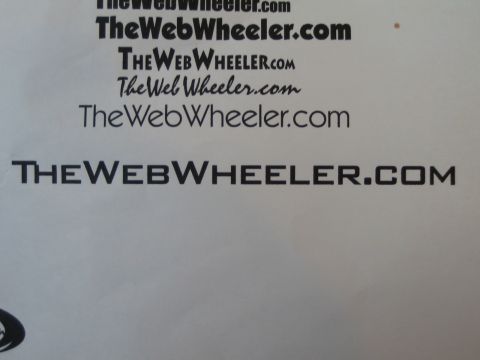 1990 Ford Bronco - photo of a printed page with the TheWebWheeler.com wordmark in various fonts, not a technical document.