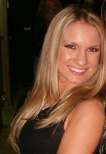2005 BMW 3 Series - A woman smiles for the camera with "SUPERMOTORS" branding visible in the lower portion of the image.