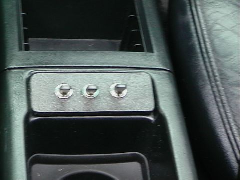 1992 Ford Taurus - Aftermarket auxiliary switches are installed in the center console of this vehicle's interior.