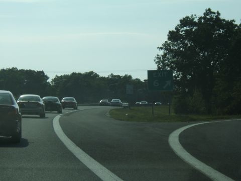 1998 Ford Taurus - Cars travel on a highway with an exit 6 sign visible in the distance.