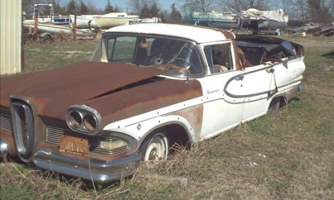 1970 Ford Ranchero - This 1957 Ford Ranchero is in poor condition, with significant rust and a damaged windshield.