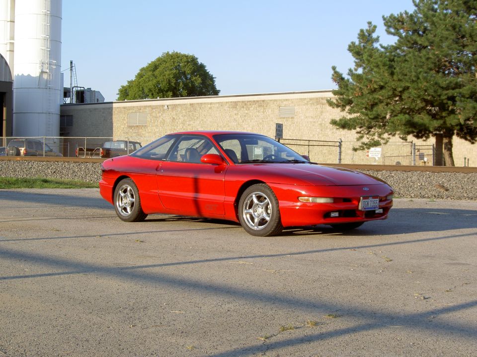 Red 1993 Ford Probe coupe, 3/4 front view