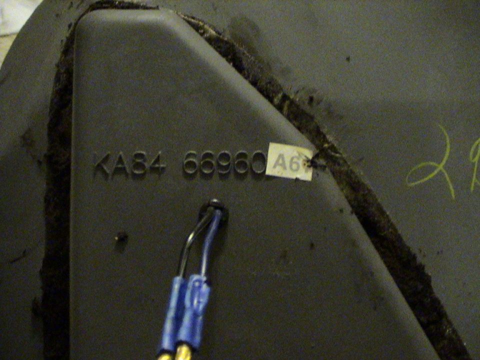 close-up of a dark-colored part with embossed numbers KA84 66960 and a sticker labeled A6