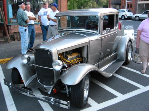 1991 Ford Explorer - This classic hot rod coupe, likely from the late 1920s, features a prominent engine and custom modifications.