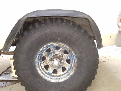 1979 Ford F-150 - This image shows a close-up of a vehicle's wheel and fender flare, with no clear year identification visible.