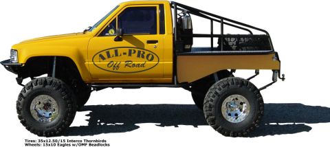 1979 Ford F-150 - Modified pickup truck with off-road tires and custom bed cage.