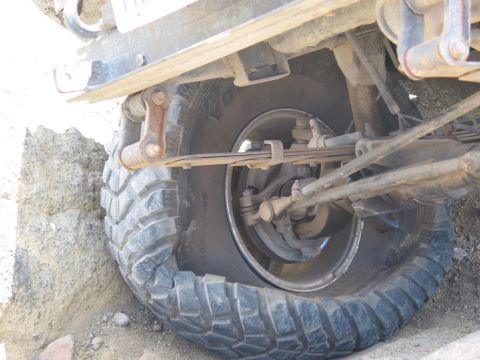 1982 Ford Customline - Close-up view of the rear suspension and tire of an off-road vehicle.